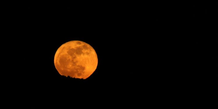 The Blue Micromoon Rises in Sunday’s Early Skies