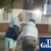 Politicians try to calm tensions inflamed by social media after stabbing in Belfast | UK news
