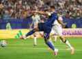 Mbappe double sends France into knockout rounds after lengthy weather delay