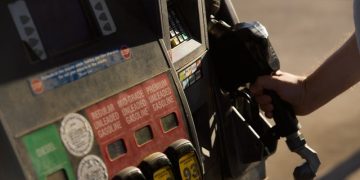 Americans are feeling a little better about the economy as gas prices ease