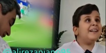 Iranian dad helps blind son feel the World Cup