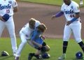 Top MLB prospect carries fainting child off field